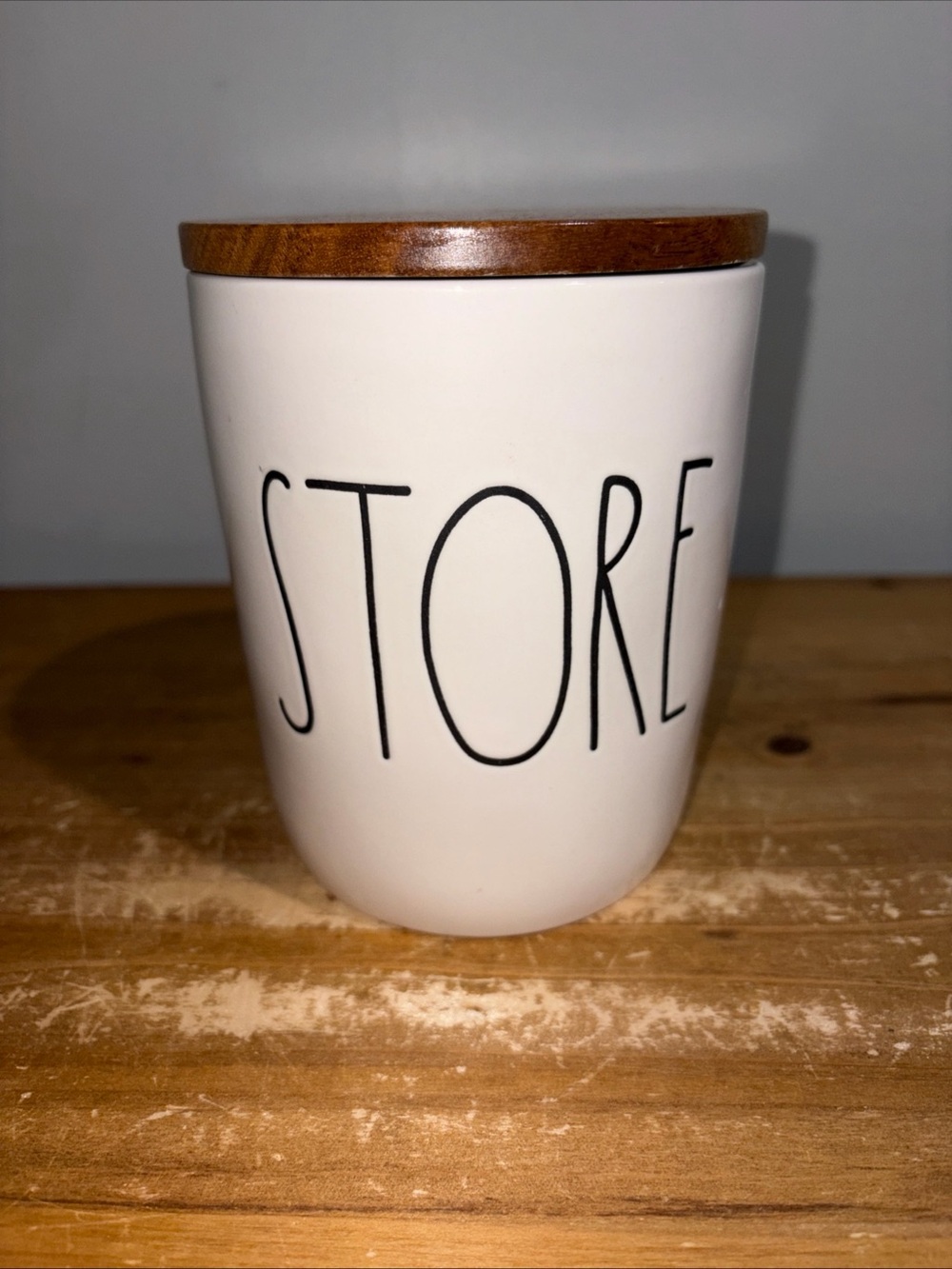 Rae Dunn “Store” Ceramic Jar with Wooden Lid - White